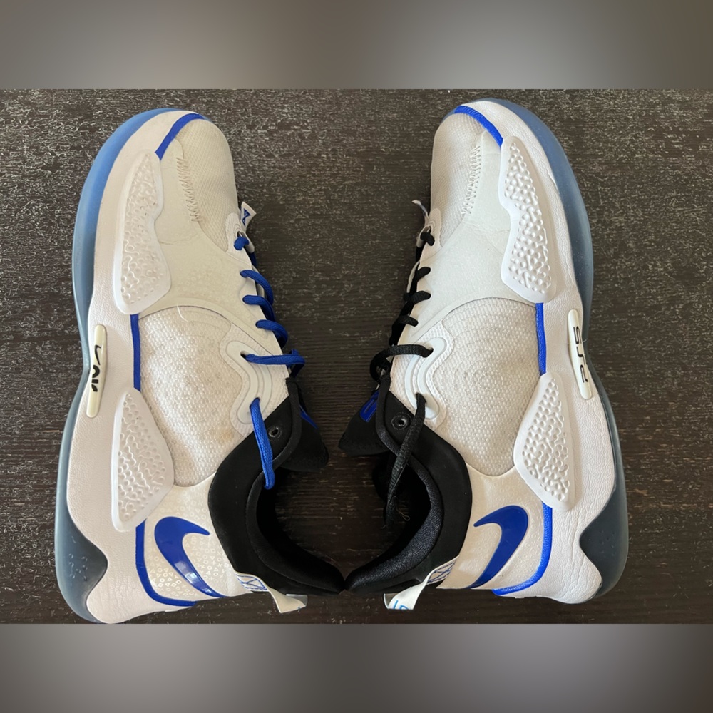 Paul George 5 basketball shoe, PlayStation edition. They are moderately used.